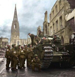 A Churchill tank crew and US Airborne troops in Münster, April 4, 1945.