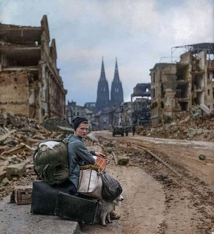 A woman sitting in the ruins of Cologne, Germany, 1945. [wra]